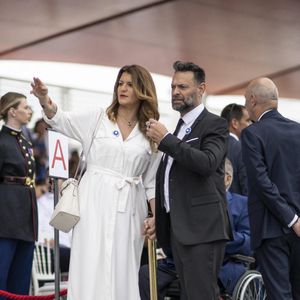 Matthias Savignac et Marlene Schiappa lors du défilé militaire du Jour de la Bastille sur l'avenue des Champs-Élysées à Paris le 14 juillet 2023.   Photo par Eliot Blondet/ABACAPRESS.COM