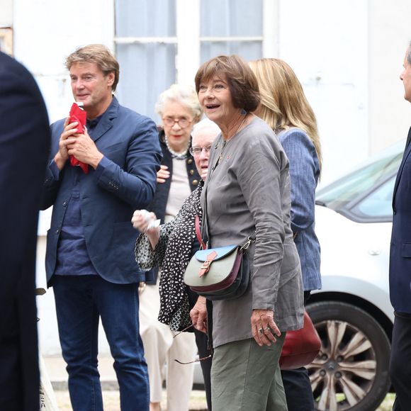 Exclusif - Macha Meril et son fils adoptif Gianguido Baldi aux obsèques de sa soeur de Macha Meril la princesse Hélène Gagarine en la cathédrale Saint-Alexandre-Nevsky, à Paris, France, le 20 août 2025. © Denis Guignebourg/Bestimage