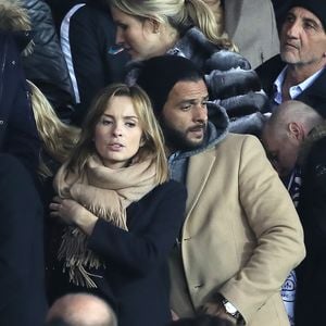 Maxim Nucci et sa compagne Isabelle Ithurburu enceinte assistent au huitième de finale retour de Ligue des Champion, du Paris Saint-Germain contre le Real Madrid au Parc des Princes à Paris le 6 mars 2018. © Cyril Moreau/Bestimage