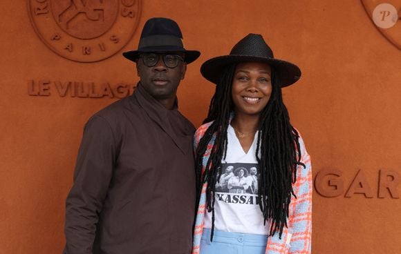 Lilian Thuram et sa femme Kareen Guiock Thuram - Célébrités au village des Internationaux de France de tennis de Roland Garros 2024 à Paris le 7 juin 2024.  © Jacovides-Moreau/Bestimage