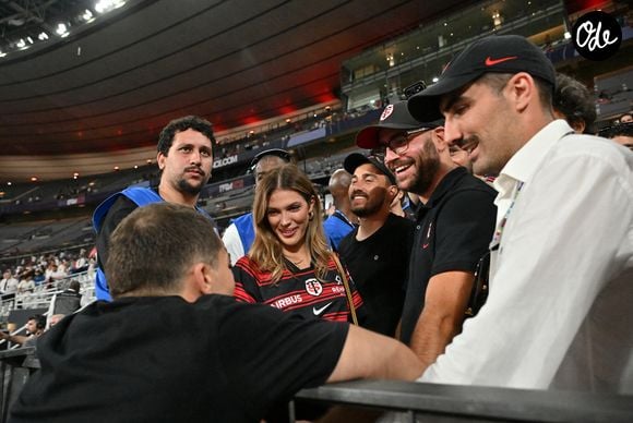 Iris Mitteneare, Antoine Dupont et son frère Clément Dupont - Victoire des Toulousains en finale du Top 14, face à Montpellier (28 - 20) au stade de France, le 27 juin 2026. 
© Christian Liewig / Bestimage