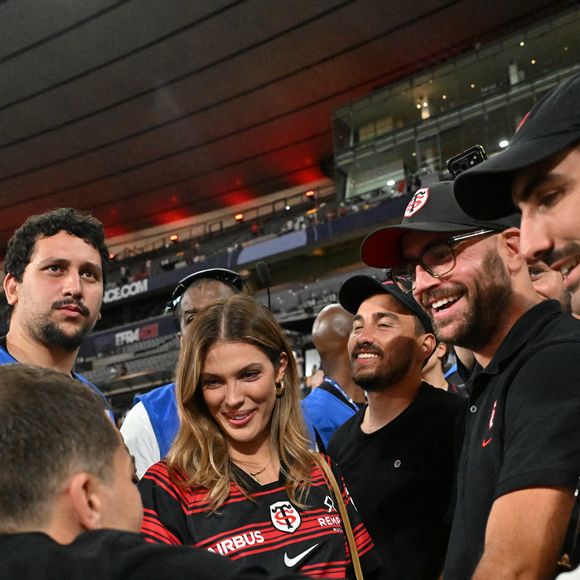 Iris Mitteneare, Antoine Dupont et son frère Clément Dupont - Victoire des Toulousains en finale du Top 14, face à Montpellier (28 - 20) au stade de France, le 27 juin 2026. 
© Christian Liewig / Bestimage