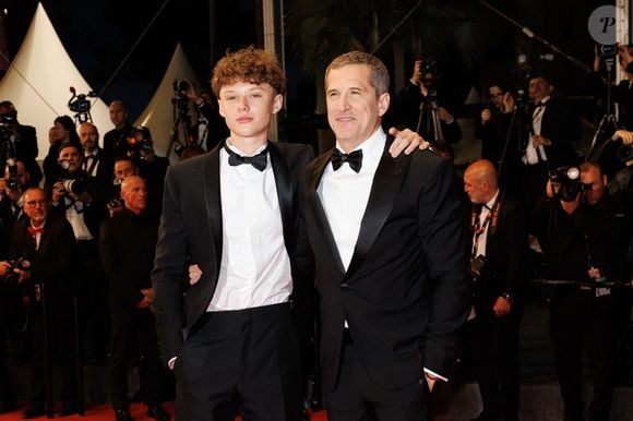 Marcel Canet et son père Guillaume Canet - Descente des marches du film " Karma " lors du 79ème Festival International du Film de Cannes, le 15 mai 2026. © Jacovides-Moreau / Bestimage