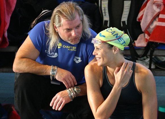 L'ex-protégée de Philippe Lucas veut désormais tester ses limites en course à pied.

EXCLUSIF - Laure Manaudou s'entretient avec son ancien entraîneur Philippe Lucas lors des championnats de France de natation en shortcourse à Nîmes, France, le 8 décembre 2007. Photo by Mehdi Taamallah/ABACAPRESS.COM