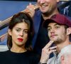 Louis Sarkozy fait actuellement la tournée des médias français pour promouvoir son dernier ouvrage intitulé :  "Napoléon Bonaparte : L’Empire des livres".

Louis Sarkozy et sa compagne Natali Husic dans les tribunes lors du match de Ligue 1, Paris Saint-Germain (PSG) vs Toulouse FC (TFC) au Parc des Princes à Paris, France. (Agence / Bestimage).