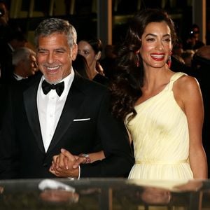 George Clooney et sa femme Amal Alamuddin Clooney (bijoux Cartier) - Descente des marches du film "Money Monster" lors du 69ème Festival International du Film de Cannes. Le 12 mai 2016. © Dominique Jacovides- Cyril Moreau/Bestimage