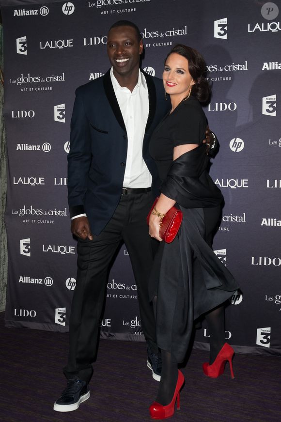 Omar Sy et son épouse assistent à la 7ème cérémonie des Globes de Cristal qui se tient au Lido sur les Champs Elysées à Paris, France, le 6 février 2012. Photo ABACAPRESS.COM