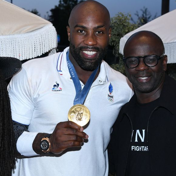 Exclusif - Lilian Thuram avec sa femme Kareen Guiock Thuram, Teddy Riner - Teddy Riner fête son titre de champion Olympique de judo +100KG au restaurant "Podium" du groupe (Les bistrots Pas Parisiens) à Paris le 2 aout 2024. © Rachid Bellak/Bestimage