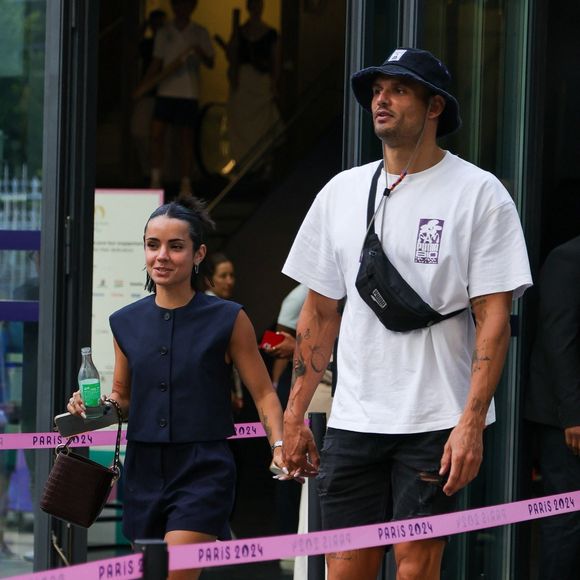 Paris, FRANCE  - Florent Manaudou and Lola Dumenil hand in hand at the France Germany basketball semi-final Olympic Games Paris 2024 in Paris, France.



Pictured: Florent Manaudou, Lola Dumenil
