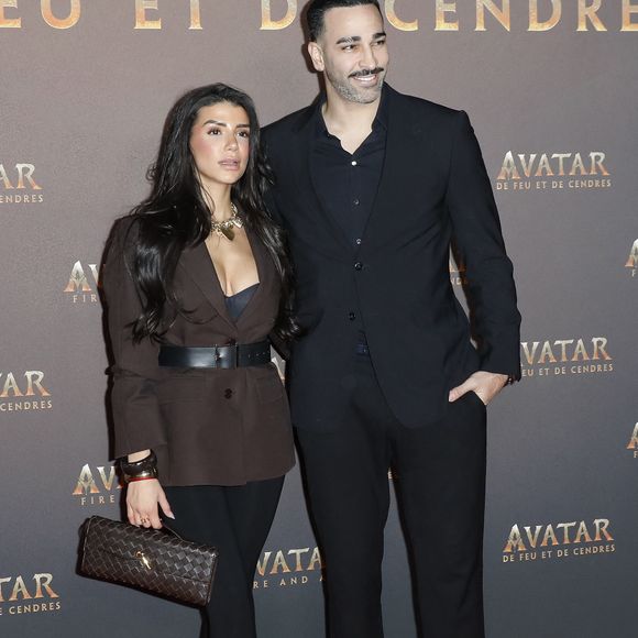 Adil Rami et sa compagne Louana Franco - Avant-première du film "Avatar : de Feu et de Cendres" à la Seine Musicale de Boulogne-Billancourt le 5 décembre 2025. © Marc Ausset-Lacroix/Bestimage