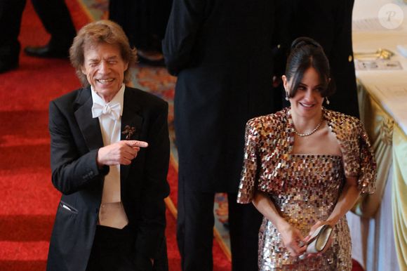 Mick Jagger du groupe de rock britannique The Rolling Stones (C-L) et sa compagne Melanie Hamrick assistent à un banquet d'État au château de Windsor, à l'ouest de Londres, le 8 juillet 2025, au premier jour d'une visite d'État de trois jours du président français en Grande-Bretagne.  Photo par Ludovic Marin/Pool/ABACAPRESS.COM