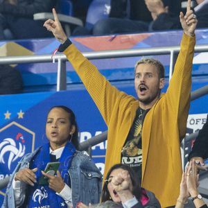 M. Pokora (Matt Pokora) et sa femme Christina Milian assistent au match de la 5ème et avant-dernière journée de Ligue des nations entre la France et l'Autriche (2-0) au Stade de France à Saint-Denis le 22 septembre 2022.