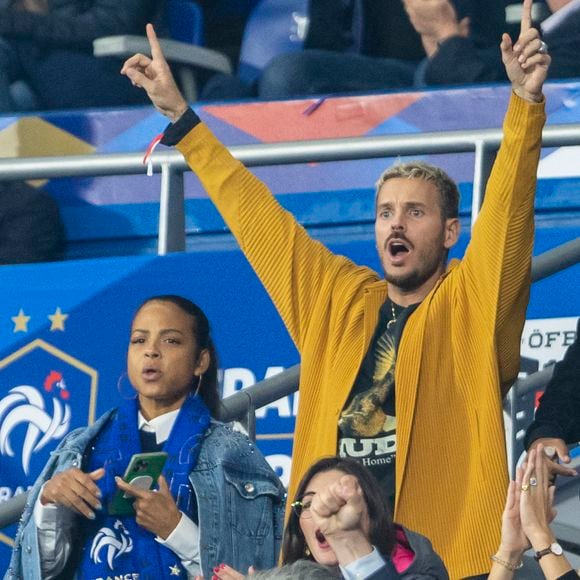 M. Pokora (Matt Pokora) et sa femme Christina Milian assistent au match de la 5ème et avant-dernière journée de Ligue des nations entre la France et l'Autriche (2-0) au Stade de France à Saint-Denis le 22 septembre 2022.