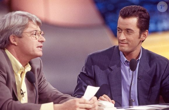 Patrice Carmouze a évoqué une "injustice" et du "gâchis"
Christophe Dechavanne et Patrice Carmouze sur le plateau de Coucou C'est Nous sur TF1 à Paris le 11 janvier 1993. L'émission a été diffusée du 22 septembre 1992 au 1er juillet 1993 et a repris en 1995. Photo by Pascal Baril/ABACAPRESS.COM