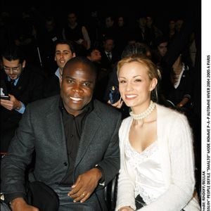 Depuis, le joueur s'est lancé dans de nombreux projets...

"Basile Boli" et "Elodie Gossuin" people défilé "Smalto" mode homme P-A-P automne-hiver 2004-2005 à Paris "plan serré" homme féminin