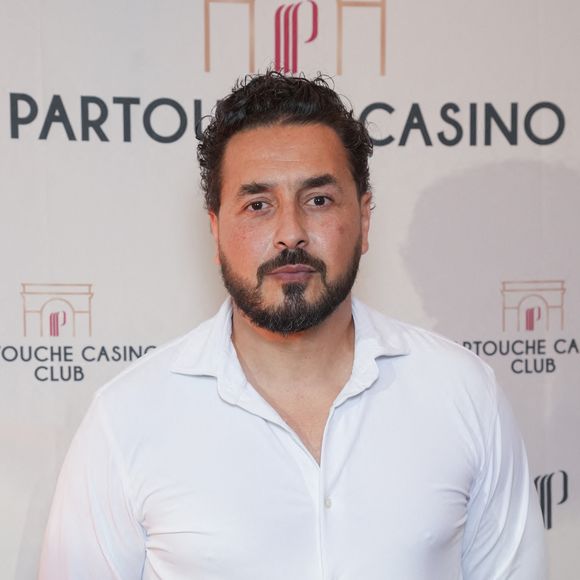 Moundir se lance dans un nouveau métier.

Moundir - Inauguration du Partouche Casino Club, 10 avenue de la Grande Armée à Paris. Partouche dévoile son club de jeux XXL à Paris. © Anne-Sophie Guebey /Bestimage