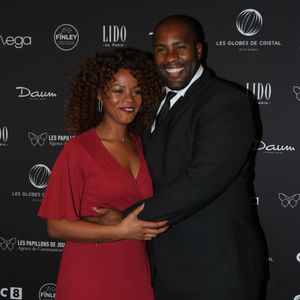 Teddy Riner et sa compagne Luthna Plocus au photocall de la 11ème cérémonie des Globes de Cristal au Lido à Paris le 30 janvier 2017. © CVS / Bestimage