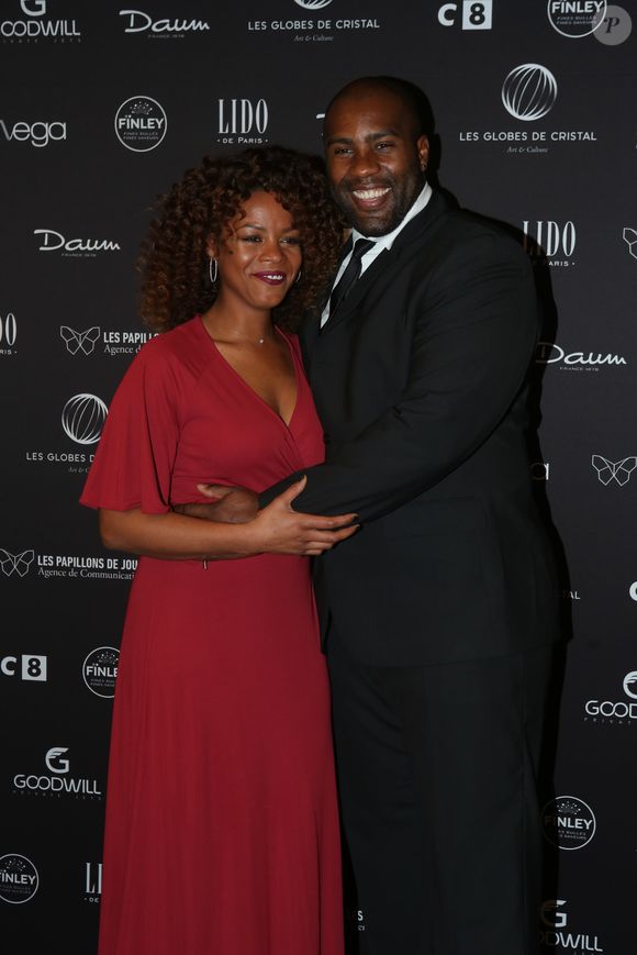 Teddy Riner et sa compagne Luthna Plocus au photocall de la 11ème cérémonie des Globes de Cristal au Lido à Paris le 30 janvier 2017. © CVS / Bestimage