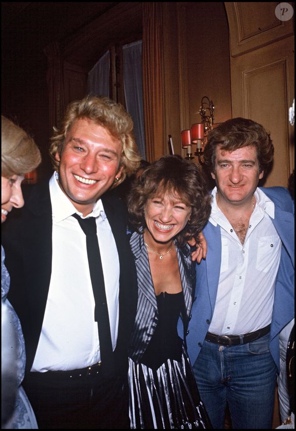 Archives - Johnny Hallyday avec Nathalie Baye et Eddy Mitchell, le soir de la première de son concert au Palais des Sports "Le Survivant (RINDOFF-PATERSON / BESTIMAGE).