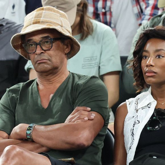 Yannick Noah et sa compagne Malika en tribunes pendant l'épreuve de basketball de Demi-Finale opposant la France à l'Allemagne lors des Jeux Olympiques de Paris 2024 (JO) à l'Arena Bercy, à Paris, France, le 8 août 2024. © Jacovides-Perusseau/Bestimage