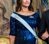 Enceinte de son quatrième enfant, la maman de trois garçons était radieuse avec cette robe bleue qui mettait on ne peut plus en valeur son ventre déjà bien arrondi. 

La princesse Sofia (enceinte) - Arrivée de la famille royale de Suède au dîner en l'honneur des lauréats du Prix Nobel 2024 au palais royal de Stockholm. Le 11 décembre 2024