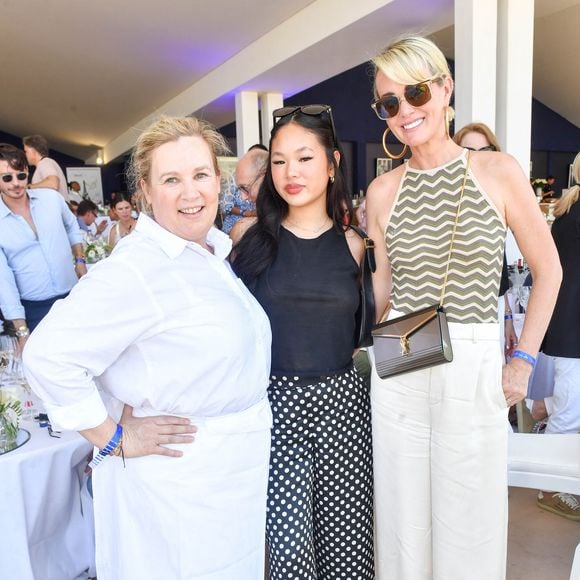 Exclusif - La cheffe Hélène Darroze, Laeticia Hallyday et sa fille Joy dans l'Espace VIP lors de la 9ème édition du "Longines Paris Eiffel Jumping" au Champ de Mars à Paris, France, le 25 juin 2023. © Perusseau-Veeren/Bestimage