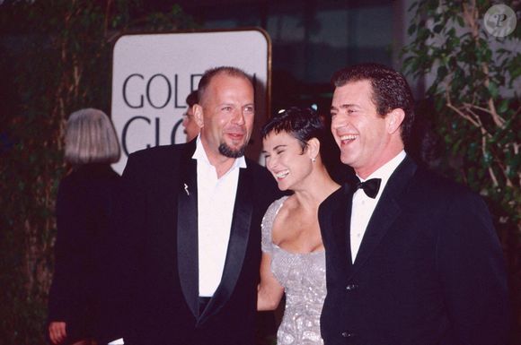 Bruce Willis, Demi Moore et Mel Gibson aux Golden Globes. 1990s Photo by Alamy/ABACAPRESS.COM