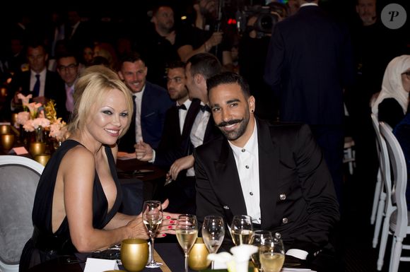 Adil Rami et Pamela Anderson lors de la soirée de la 28ème cérémonie des trophées UNFP (Union nationale des footballeurs professionnels) au Pavillon d'Armenonville à Paris, France, le 19 mai 2019.