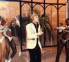 En effet, Claude François Junior gère aujourd'hui le patrimoine musical de son défunt père et a créé des Croisières hommage à son père où il embarque des centaines de fans...

Claude Francois et les Clodettes en 1977. Crédit Jlppa / Bestimage