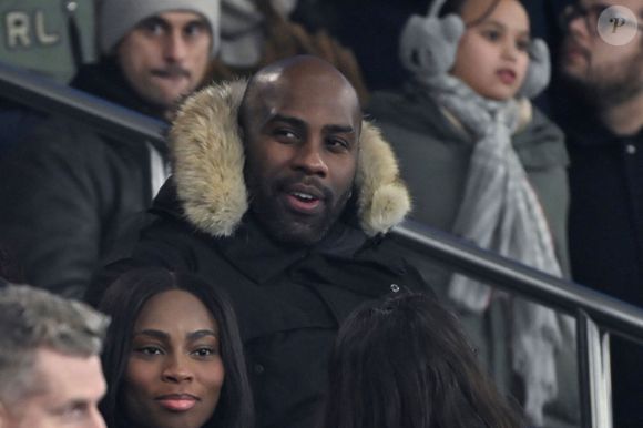 Teddy Riner - Célébrités dans les tribunes du match de Ligue 1 McDonald's opposant le Paris Saint-Germain (PSG) à L’AS Monaco (4-1) au Parc des Princes à Paris le 7 février 2025.