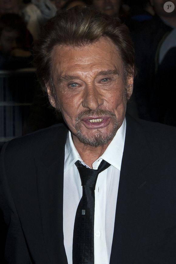 Johnny Hallyday assiste à la première du film 'Salaud On T?aime' qui s'est tenue au cinéma UGC Normandie à Paris, France le 31 mars 2014. Photo by Nicolas Genin/ABACAPRESS.COM