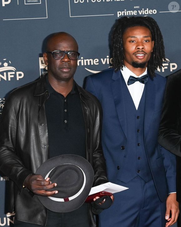 Lilian Thuram et son fils Khephren Thuram - Photocall de la cérémonie des Trophées UNFP 2022 au Pavillon Gabriel à Paris le 15 mai 2022. © Coadic Guirec/Bestimage