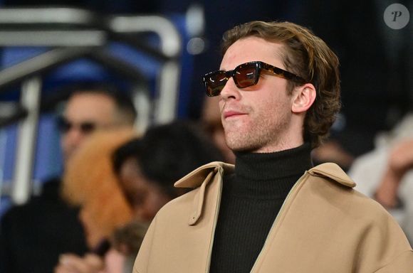 Exclusif - Benjamin Voisin dans les tribunes du match de 8ème de finale de la Ligue Des Champions 2025-2026 (LDC) "Paris-Saint-Germain (PSG) - AS Monaco (2-2)" au Parc des Princes à Paris, le 25 février 2026.
© Christian Liewig/Bestimage