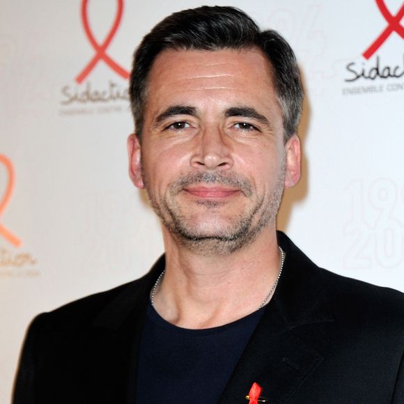 Olivier Minne posant lors d'un photocall pour le lancement du Sidaction 2014 et du 'Sidaction 20e anniversaire' qui s'est tenu au Musée du quai Branly à Paris, France, le 10 mars 2014. Photo par Aurore Marechal/ABACAPRESS.COM