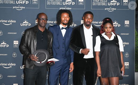 Lilian Thuram avec ses fils Khephren Thuram, Marcus Thuram, guest - Photocall de la cérémonie des Trophées UNFP 2022 au Pavillon Gabriel à Paris le 15 mai 2022. © Coadic Guirec/Bestimage
