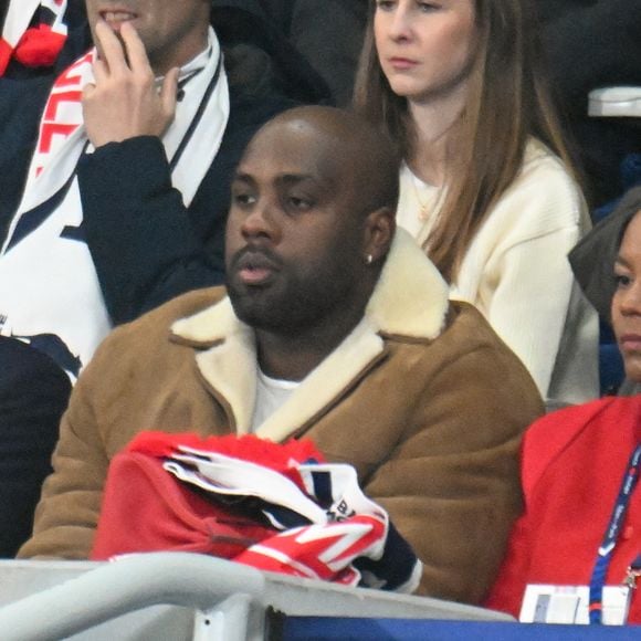 Tony Estanguet, Teddy Riner et sa femme Luthna Plocus au match de rugby du Tournoi des Six Nations France contre Angleterre au Stade de France à Saint-Denis le 14 mars 2026

© Lionel Urman / Bestimage