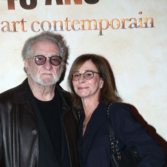 Eddy Mitchell et sa femme Muriel Bailleul - " Voir venir Venir voir ", Célébration des 40 ans de la Fondation Cartier pour l'art contemporain avec la " Traversée du chantier de la nouvelle Fondation Cartier ", place du Palais Royal, dont l'ouverture se fera en décembre 2025. Paris, France, le 18 octobre 2024. © Bertrand Rindoff/Bestimage