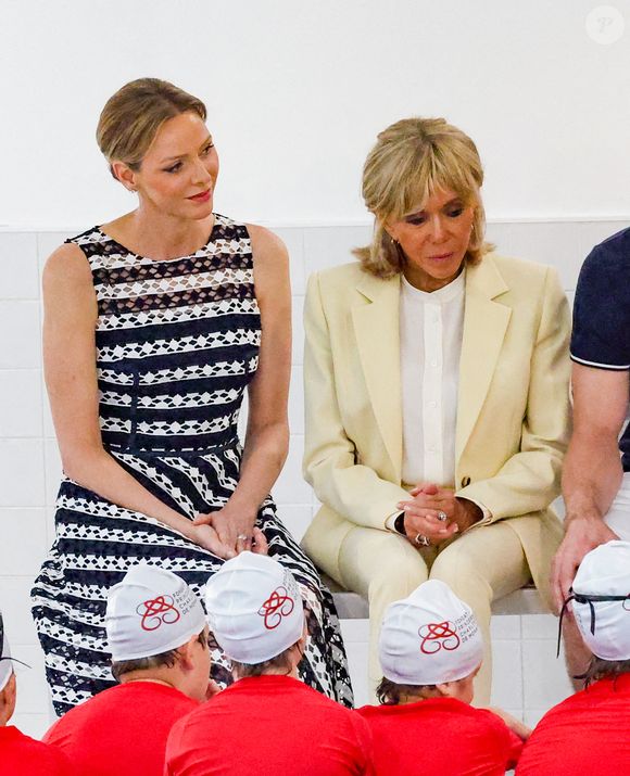 La princesse Charlène de Monaco et la Première Dame française Brigitte Macron lors d'un Water Safety Day de la Fondation Princesse Charlène de Monaco à la piscine du Stade Louis II de Monaco, le 8 juin 2025. © Claudia Albuquerque/Bestimage