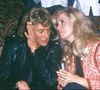 Johnny Hallyday, icône de la chanson française, a souvent été associé à ces spéculations

Johnny Hallyday avec Catherine Deneuve le jour de son anniversaire en 1980. © Bestimage