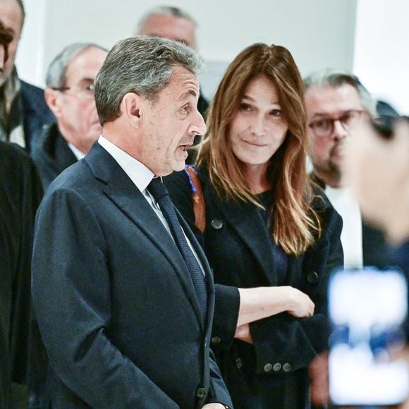 Nicolas Sarkozy et sa femme Carla Bruni - Nicolas Sarkozy condamné à 5 ans de prison à l'issue du procès de l'affaire du financement libyen au tribunal correctionnel de Paris, le 25 septembre 2025. L'ancien chef de l'Etat était accompagné de sa femme, C.Bruni. Nicolas Sarkozy, jugé coupable d’association de malfaiteurs, sera prochainement convoqué en vue de lui signifier la date de son incarcération. 
© Christian Liewig / Bestimage