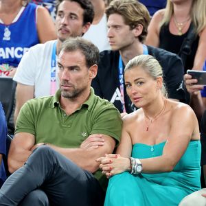 Bruno Cheyrou et Laure Boulleau - Les célébrités assistent à la victoire de l'équipe de France de basket face au Canada (82-73) lors des Jeux Olympiques de Paris2024, le 6 août 2024. © Jacovides-Perusseau / Bestimage