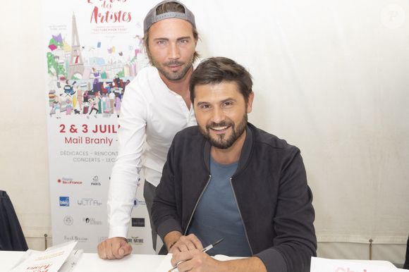 Exclusif - Ghislain Gerin et son mari Christophe Beaugrand - Festival des Livres et des Artistes organisé par l'association "Lecture pour Tous" engagée dans la lutte contre l'illettrisme au Mail Branly à Paris le2 juillet 2022. © Pierre Perusseau/ Jack Tribeca / Bestimage