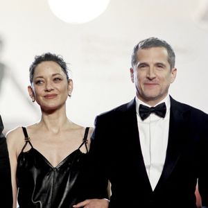 Interrogée par l'AFP, Marion Cotillard s’est emmêlée les pinceaux en évoquant Guillaume Canet.

Marion Cotillard et Guillaume Canet - Descente des marches du film " Karma " lors du 79ème Festival International du Film de Cannes. © Jacovides-Moreau / Bestimage