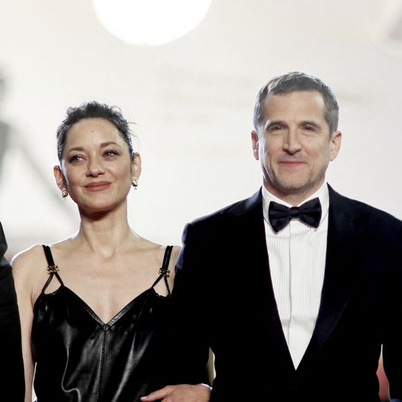 Interrogée par l'AFP, Marion Cotillard s’est emmêlée les pinceaux en évoquant Guillaume Canet.

Marion Cotillard et Guillaume Canet - Descente des marches du film " Karma " lors du 79ème Festival International du Film de Cannes. © Jacovides-Moreau / Bestimage