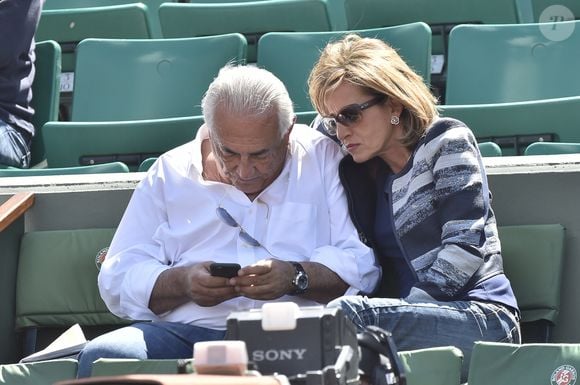 Dominique Strauss Kahn et sa compagne Myriam L'Aouffir assistant aux Internationaux de France de Tennis à Roland Garros à Paris, le 30 mai 2015.