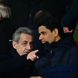 Nicolas Sarkozy, Nasser al-Khelaïfi - Célébrités dans les tribunes lors du match de Ligue des Champions entre le Paris Saint Germain contre Tottenham Hotspur Football Club (5-3) au Parc des Princes à Paris le 26 novembre 2025. © Christian Liewig/Bestimage