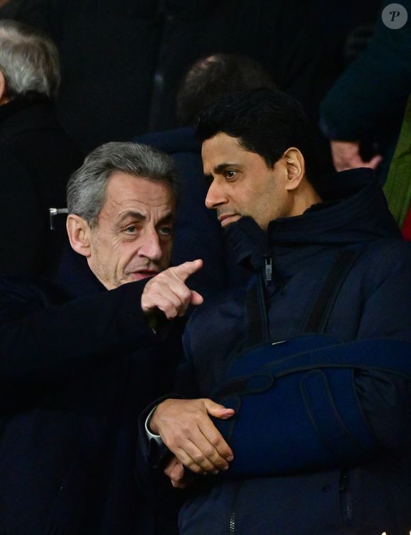 Nicolas Sarkozy, Nasser al-Khelaïfi - Célébrités dans les tribunes lors du match de Ligue des Champions entre le Paris Saint Germain contre Tottenham Hotspur Football Club (5-3) au Parc des Princes à Paris le 26 novembre 2025. © Christian Liewig/Bestimage
