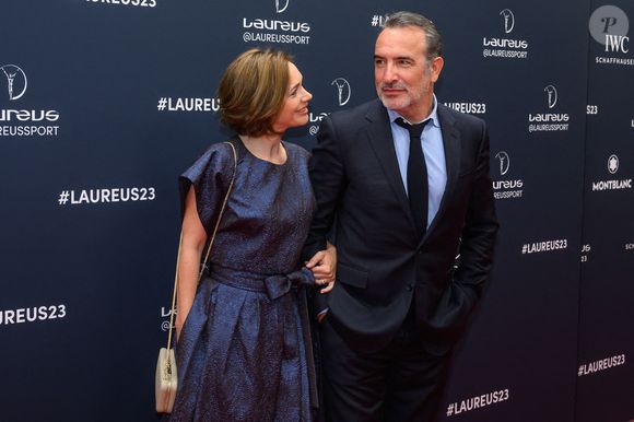 L'acteur Jean Dujardin et la danseuse sur glace Nathalie Pechalat arrivent au tapis rouge des Laureus World Sport Awards Paris 2023 à la Cour Vendôme le 08 mai 2023 à Paris, France. Photo by ABACAPRESS.COM