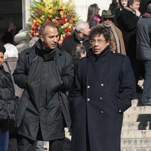 Pascal Legitimus et Laurent Voulzy quittant la messe de funérailles du chanteur légendaire Henri Salvador à l'église de la Madeleine à Paris, France, le 16 février 2008. Salvador est décédé à l'âge de 90 ans d'un anévrisme à son domicile parisien le 13 février. Photo ABACAPRESS.COM