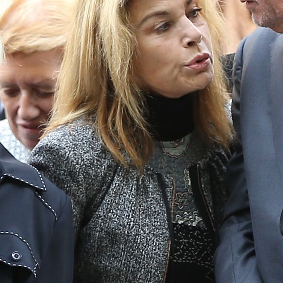 Nicole Calfan et Alain Delon - Obsèques de Pierre Mondy en l'église Saint-Honoré d'Eylau à Paris, le 20 septembre 2012.